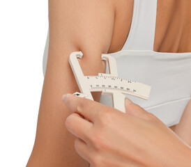 Poster - Nutritionist measuring woman's body fat with caliper on white background, closeup