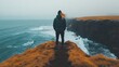 © arsyi_06 - Person standing on cliff by the ocean.