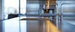 © N - A stainless steel sink with a silver faucet sits on a countertop