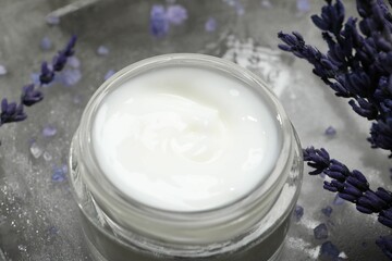 Poster - Spa composition with jar of cosmetic product and lavender flowers on grey table, closeup