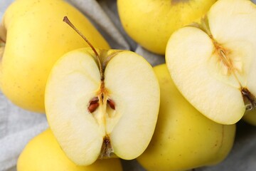 Fresh ripe yellow apples on table, closeup