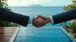 © Johannes - Buyer and seller waring a suit shake hands after selling a villa with a pool by the sea, successful agreement
