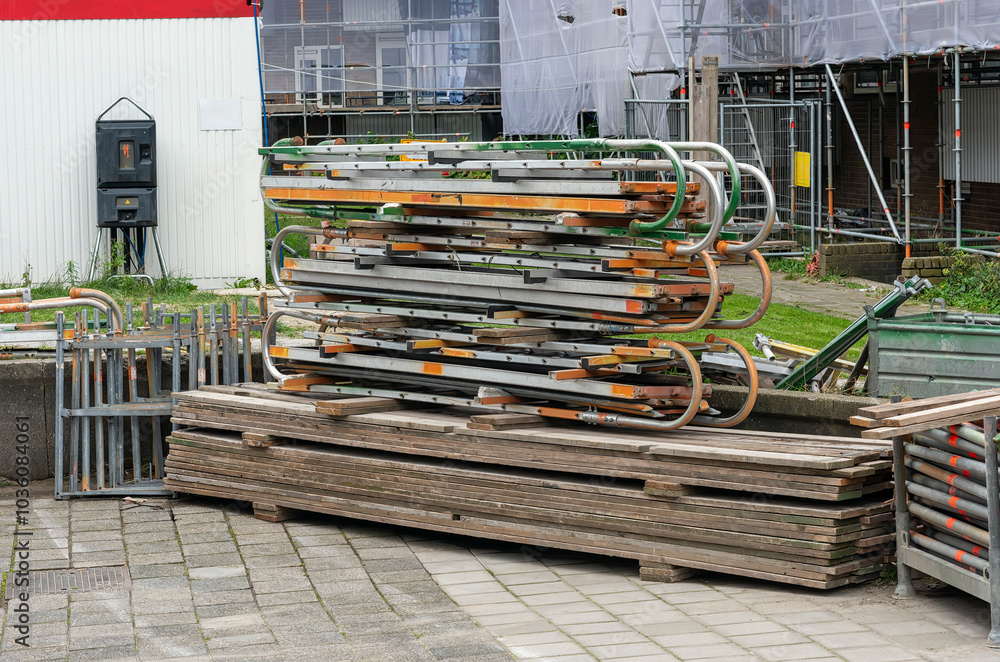 various scaffolding components such as wooden planks and pipes
