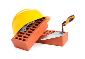 Poster - Red bricks, hard hat and trowel on white background