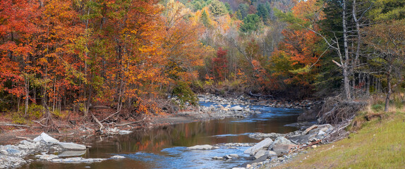 Wall Mural - panoramic view of scenic river landscape during autumn time in vermont.