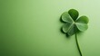 © CreativeBro - Bright green background featuring a four leaf clover symbolizing good luck