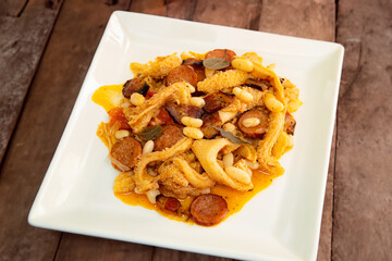 Wall Mural - Beef tripe (bucho), beef stomach, tripe on a white plate. Dobradinha