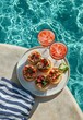 © olegganko - Delicious canapes by the poolside with refreshing drinks and summer vibes in bright sunlight