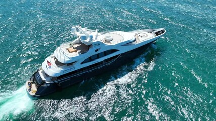 Sticker - Aerial drone video of beautiful modern small yacht cruising in low speed in Aegean deep blue sea