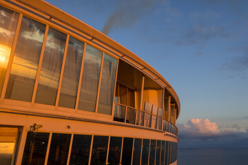 Front deck of the cruise liner under evening sun light.