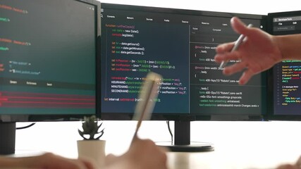 Back end software developer engineer for computer programming working together on debugging writing computing code, solving complex algorithms display on monitor in office. Burgeoning
