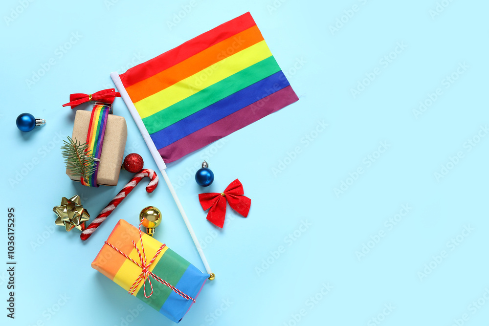 LGBT flag with gift boxes and Christmas decor on blue background