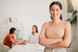 © KayExam/peopleimages.com - Girl, confident and portrait in office for creativity, small business growth or career development. Woman leader, happy or arms crossed in design agency for ambition, startup pride or smile with team