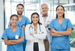 © CineLens2024/peopleimages.com - Portrait, people and healthcare with confident in hospital for medical service, collaboration and career pride. Smile, staff and arms crossed with team leadership, about us and treatment for wellness