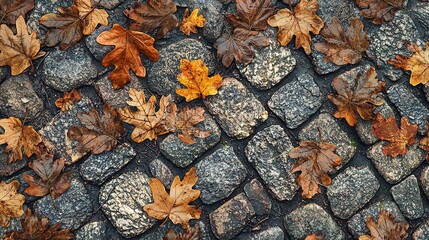 Wall Mural -   A cluster of leaves scattered on a cobblestone street adjacent to a traffic sign and another traffic sign