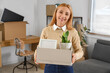 © Pixel-Shot - Mature businesswoman with box of things in office on moving day