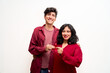 © Fabián Montaño - Young Latin couple, holds red ribbon for World AIDS Day