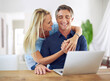 © ArcursForPI/peopleimages.com - Banking, laptop and online with mature couple for investment growth, hug and retirement fund. Financial planning, love and savings with man and woman at home for insurance, taxes or asset management