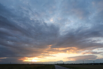 Wall Mural - beautiful cloudy sky over highway on sunset