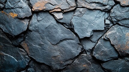 Poster - A close-up view reveals a textured slate stone wall displaying various shades of gray alongside subtle rust accents under natural light. The stones interlock beautifully, showcasing unique patterns.