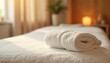 © SwathiFX - Elegant spa setting with neatly rolled towels