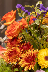 Wall Mural - Full frame macro abstract texture background of an indoor floral arrangement, featuring red and pink roses
