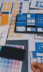 Wall Mural - the designer team is designing the uxui system to make the uxui system work well on new phones and s