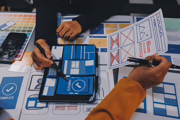The designer team is designing the uxui system to make the uxui system work well on new phones and support system updates. Website development concept UI UX front end designer