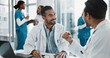 © PeakPoints/peopleimages.com - Meeting, men and doctors in office at hospital for planning medical diagnosis, treatment or surgery. Discussion, interview and healthcare worker with board director at clinic for feedback or review.