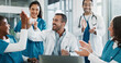 © PeakPoints/peopleimages.com - Team, doctor and laptop with applause in hospital for medical success, celebration and promotion news. Happy, people and clapping with online email, healthcare winner and congratulations for funding
