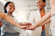 © KayExam/peopleimages.com - Business women, hands together or meeting with unity for motivation, teamwork or collaboration at office. Female people, employees or colleagues piling in solidarity for mission, support or agreement