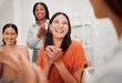 © KayExam/peopleimages.com - Women, applause and team with presentation at startup with smile, support and group celebration with goals. Business people, happy and diversity with cheers, success and meeting at creative agency