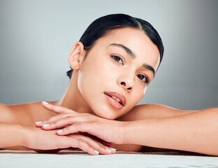 Canvas Print - Skincare, collagen and portrait of woman in studio with hydration, beauty or facial routine. Natural, health and female person from Puerto Rico with face dermatology treatment by gray background.