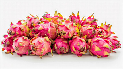 Wall Mural - A vivid arrangement of dragon fruits with pink skin and green tips on a white background