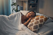 © CourtH/peopleimages.com - Woman, night and sleeping in bed for tired, comfort and exhausted in home with blanket and pillow. Female person, fatigue and asleep in bedroom for nap, dream and burnout with relax, peace and break