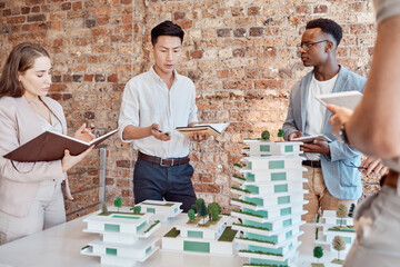 Wall Mural - Man, architect and notebook with team, model and building with ideas, talk and group in office. Person, women and discussion for review, diversity or design for skyscraper with property development