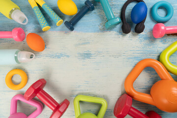 top view of  exercising sport equipment on the blue table background, healthy and workout concept