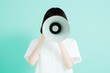 © JP STUDIO LAB - Person in a white shirt holding a megaphone, covering their face, symbolizing communication, announcement, and spreading a message with a blank background