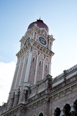 low angle of clock tower at Sultan Abdul Samad Building, Kuala Lumpur, Malaysia. Dataran Merdeka clock tower, historical and old architecture, national heritage of Malaysia