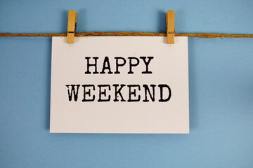 Wall Mural - happy weekend text on paper card on blue background