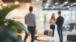 © Vicky - Business open modern office daytime daylight with blurred people in smart casual wear having a meeting. Working culture chill happy enjoy workplace work life balance plant green interior sustainable