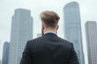 © Manyapha - On a business trip through a vibrant city, a professional carrying a briefcase navigates the busy streets, with sleek modern skyscrapers towering above him.