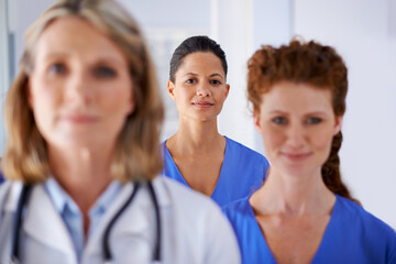 Poster - Portrait, group of people and doctor in hospital for surgery, checkup or consultation in clinic. Team, women and nursing professional as medical staff with pride for healthcare, medicine and wellness