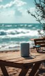 © jambulart - Bluetooth speaker on wooden table by the ocean.