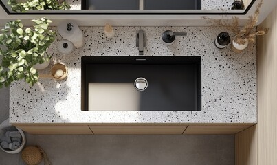 A black sink with a silver faucet sits on a white countertop