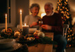 © Hanna - Happy couple celebrating Christmas with festive decor and cozy candles at home during a joyful evening gathering