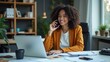© Trust Fish - Happy Businesswoman on Phone Call in Modern Office Setting
