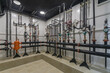 © alhim - A control room featuring various plumbing components including valves, gauges, and piping, designed for managing water or gas systems efficiently.