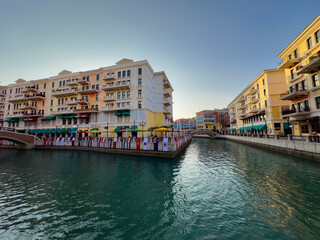 Qanat Quartier on The Pearl Island in Qatar, which is characterized by brightly colored buildings, a lake in the middle, restaurants and shops, is one of the beautiful . Doha Qatar