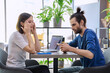 © Valerii Honcharuk - Serious sad upset young couple sitting together in cafeteria